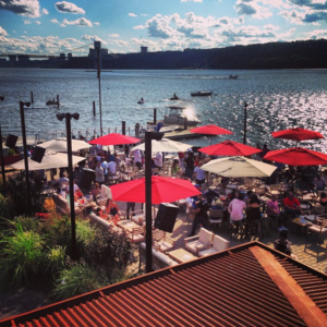 a view from The Hudson's outdoor restaurant area, looking over the Hudson river on a beautiful summer afternoon